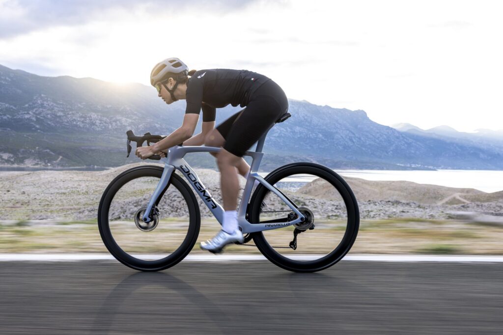 Pinarello Dogma F race bike being ridden on a mountain road