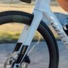 Rider climbing on a white Wilier road bike