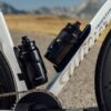 Two riders on white aero road bikes