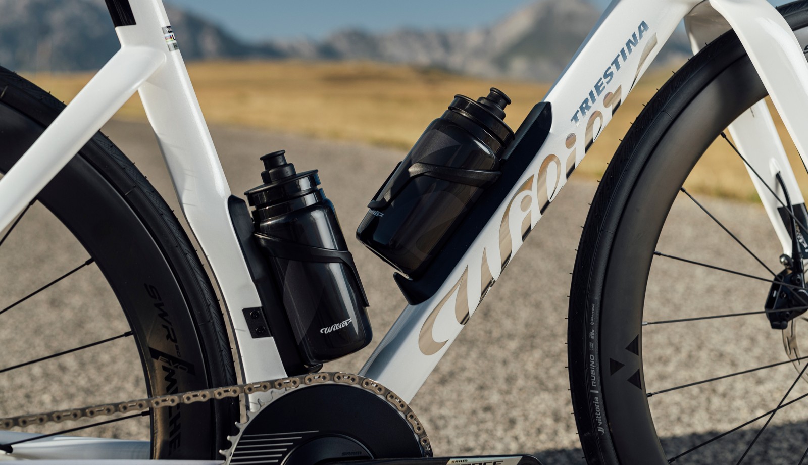 Two riders on white aero road bikes