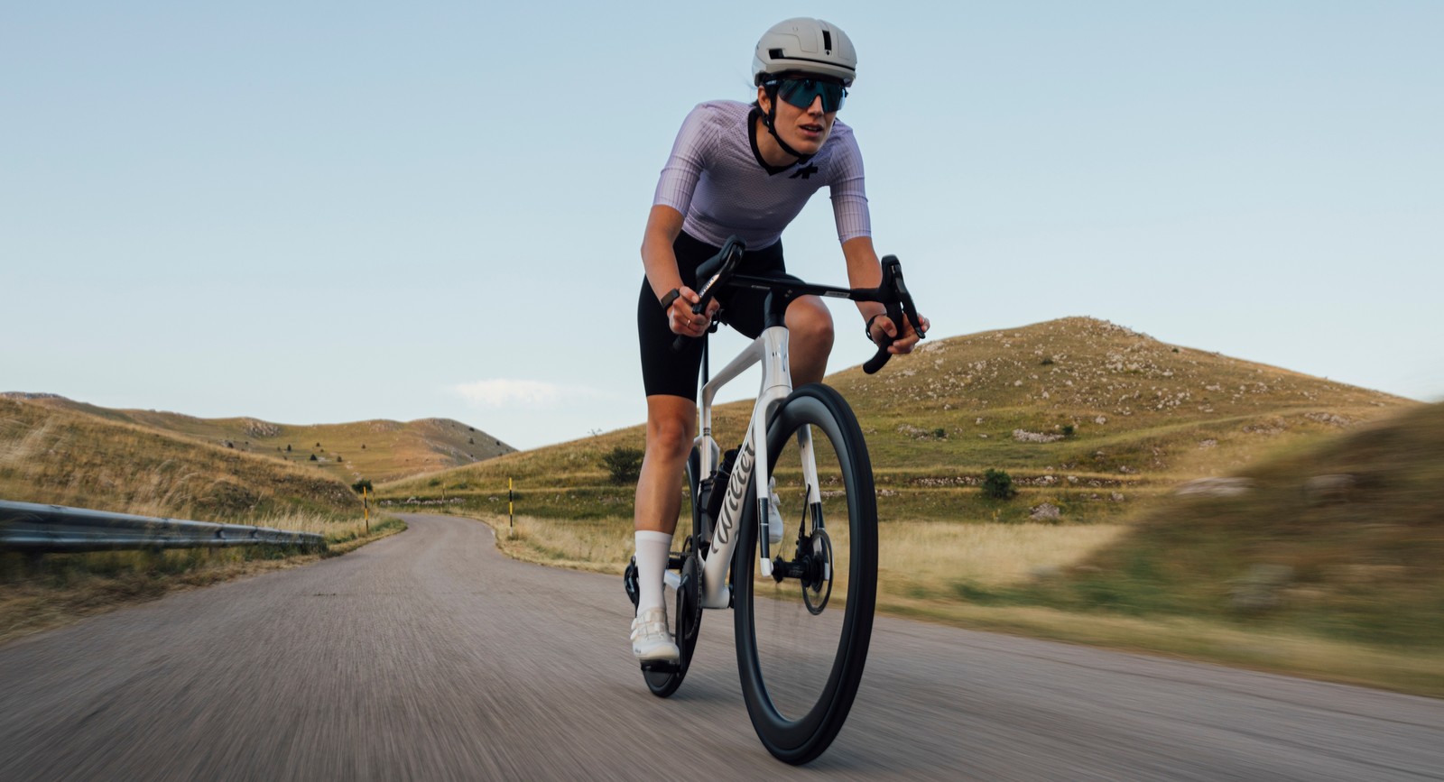 Drive White aero road bike on a mountain road